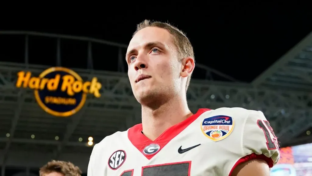 Carson Beck #15 of the Georgia Bulldogs celebrates after beating the Florida State Seminoles 63-3 to win the Capital One Orange Bowl at Hard Rock Stadium on December 30, 2023 in Miami Gardens, Florida.