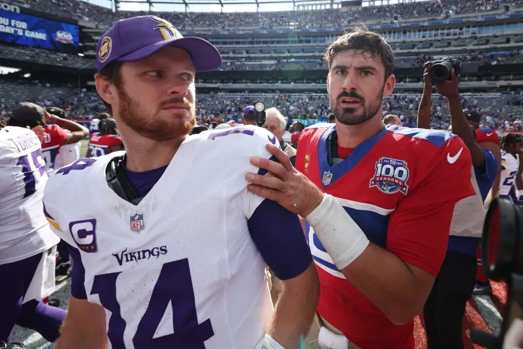 EAST RUTHERFORD, NEW JERSEY – SEPTEMBER 08: Daniel Jones #8 of the New York Giants greets Sam Darnold #14 of the Minnesota Vikings after the game at MetLife Stadium on September 08, 2024 in East Rutherford, New Jersey. The Vikings defeated the Giants 28-6. (Photo by Luke Hales/Getty Images)