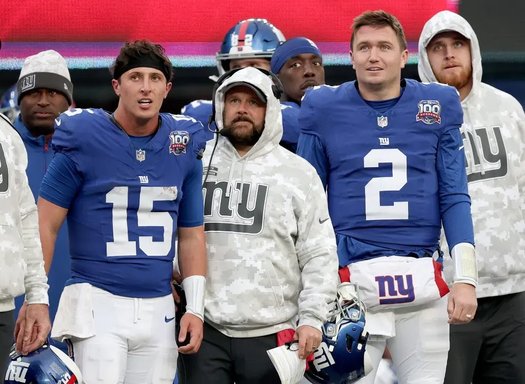 EAST RUTHERFORD, NEW JERSEY ā NOVEMBER 24: Tommy DeVito #15, head coach Brian Daboll and Drew Lock #2 of the New York Giants react on the sideline the extra point was made on a Giants touchdown against the Tampa Bay Buccaneers at MetLife Stadium on November 24, 2024 in East Rutherford, New Jersey. (Photo by Elsa/Getty Images)