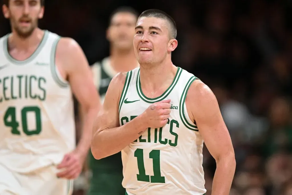 Payton Pritchard #11 of the Boston Celtics reacts after making a three-point basket against the Milwaukee Bucks during the first half at the TD Garden on October 28, 2024 in Boston, Massachusetts.