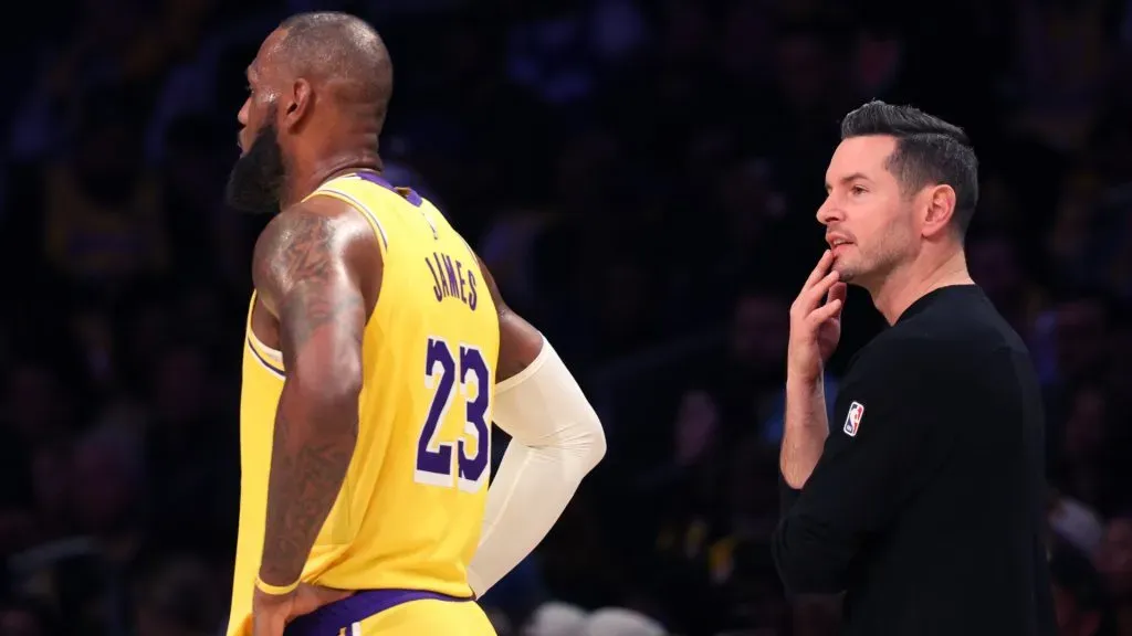 LeBron James #23 of the Los Angeles Lakers and head coach JJ Redick look on during the third quarter against the Minnesota Timberwolves at Crypto.com Arena. (Harry How/Getty Images)