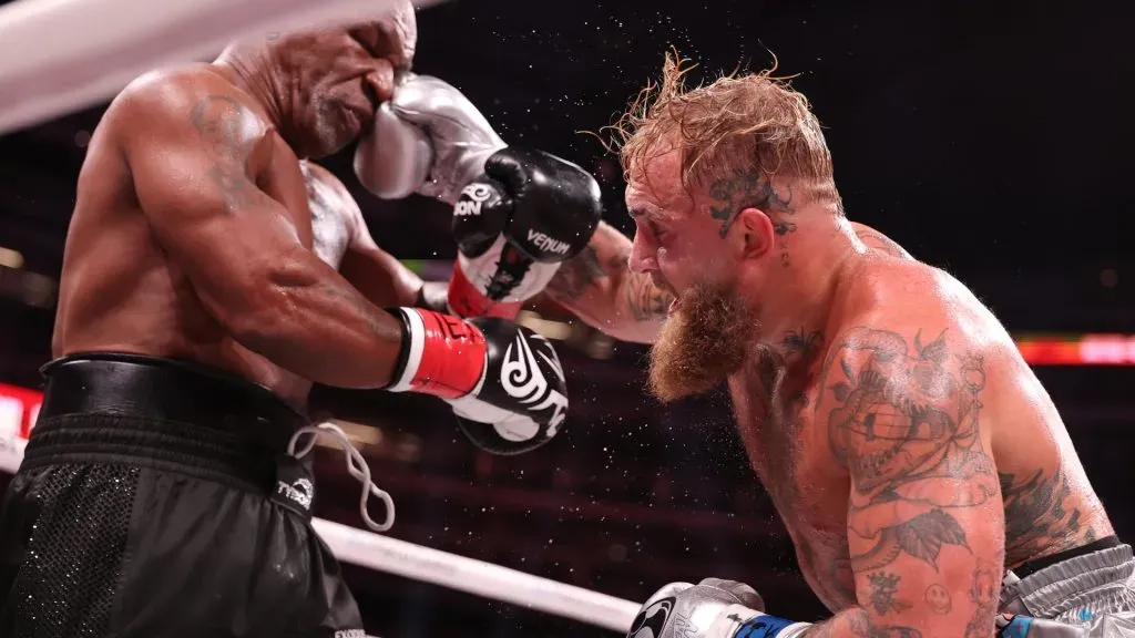Jake Paul punches Mike Tyson during LIVE On Netflix: Jake Paul vs. Mike Tyson at AT&T Stadium on November 15, 2024 in Arlington, Texas. (Photo by Al Bello/Getty Images for Netflix © 2024)