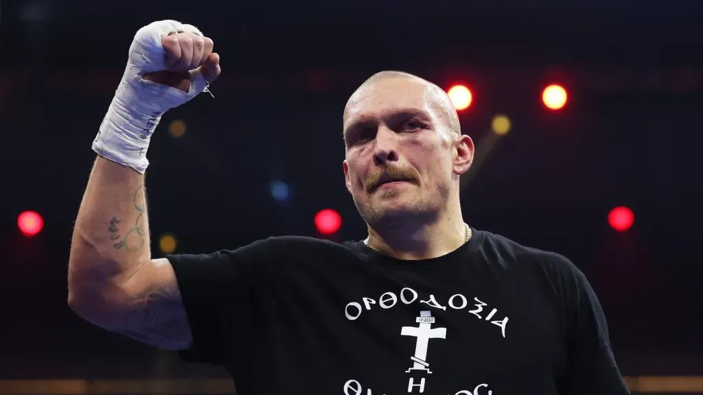 Usyk celebrates victory following the IBF, IBO, WBA, WBC and WBO Undisputed World Heavyweight titles’ fight (Richard Pelham/Getty Images)