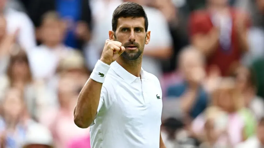 Novak Djokovic celebrates winning match point against Pedro Cachin of Argentina in the Men’s Singles first round match on day one of The Championships Wimbledon 2023. (Source: Shaun Botterill/Getty Images)