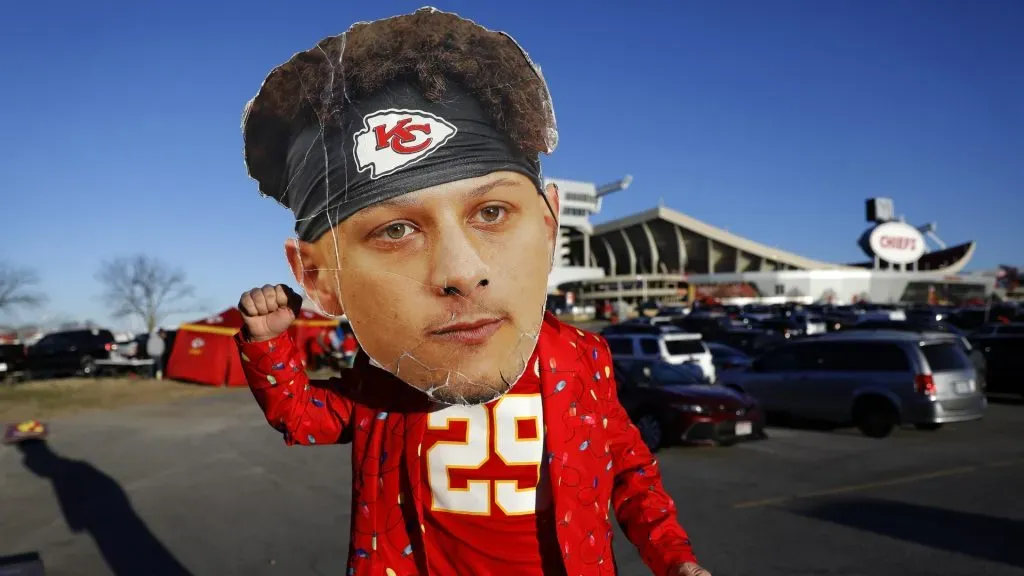 A Kansas City Chiefs fan wearing a large cutout of Patrick Mahomes face poses outside the stadium prior to the game against Las Vegas Raiders in 2021. (Source: David Eulitt/Getty Images)