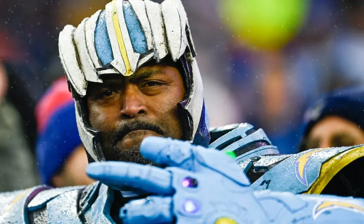 A Los Angeles Chargers fan poses for a photo during the game between the Los Angeles Chargers and the New England Patriots in 2023. (Source: Billie Weiss/Getty Images)