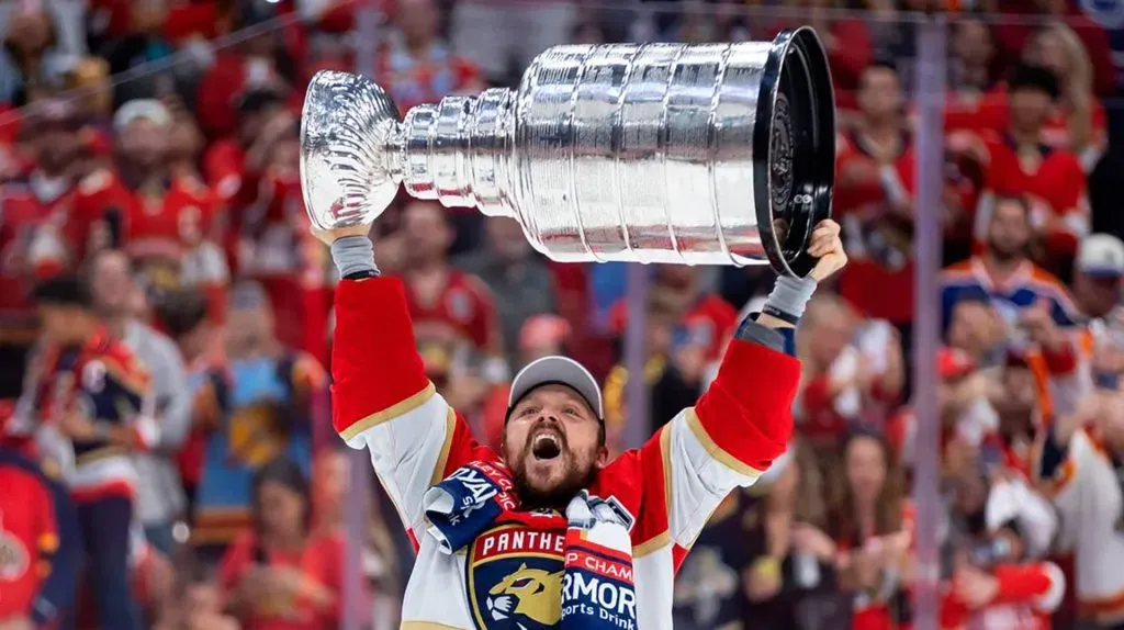 Florida Panthers center Sam Reinhart (13) lifts the Stanley Cup after defeating the Edmonton Oilers in Game 7 of the Stanley Cup Final at Amerant Bank Arena on June 24, 2024, in Sunrise, Florida.