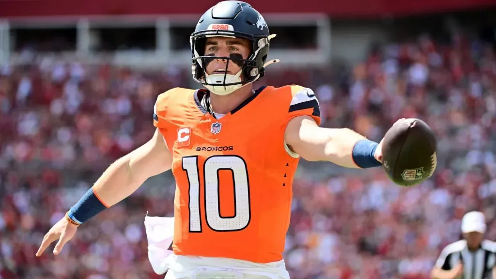Quarterback Bo Nix #10 of the Denver Broncos rushes the ball for a touchdown against the Tampa Bay Buccaneers during the first quarter of the game at Raymond James Stadium on September 22, 2024. (Source: Julio Aguilar/Getty Images)