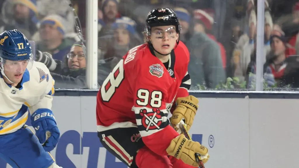 Connor Bedard #98 of the Chicago Blackhawks skates against Cam Fowler #17 of the St. Louis Blues during the third period in the 2024 NHL Winter Classic at Wrigley Field on December 31, 2024 in Chicago, Illinois.