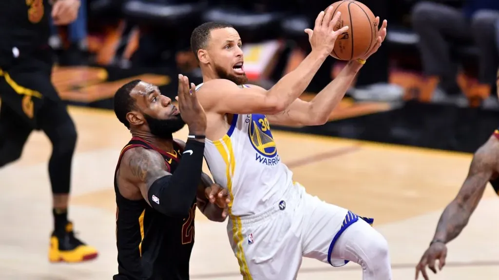 Stephen Curry #30 of the Golden State Warriors attempts a layup defended by LeBron James #23 of the Cleveland Cavaliers in the third quarter during Game Three of the 2018 NBA Finals. (Source: Jamie Sabau/Getty Images)