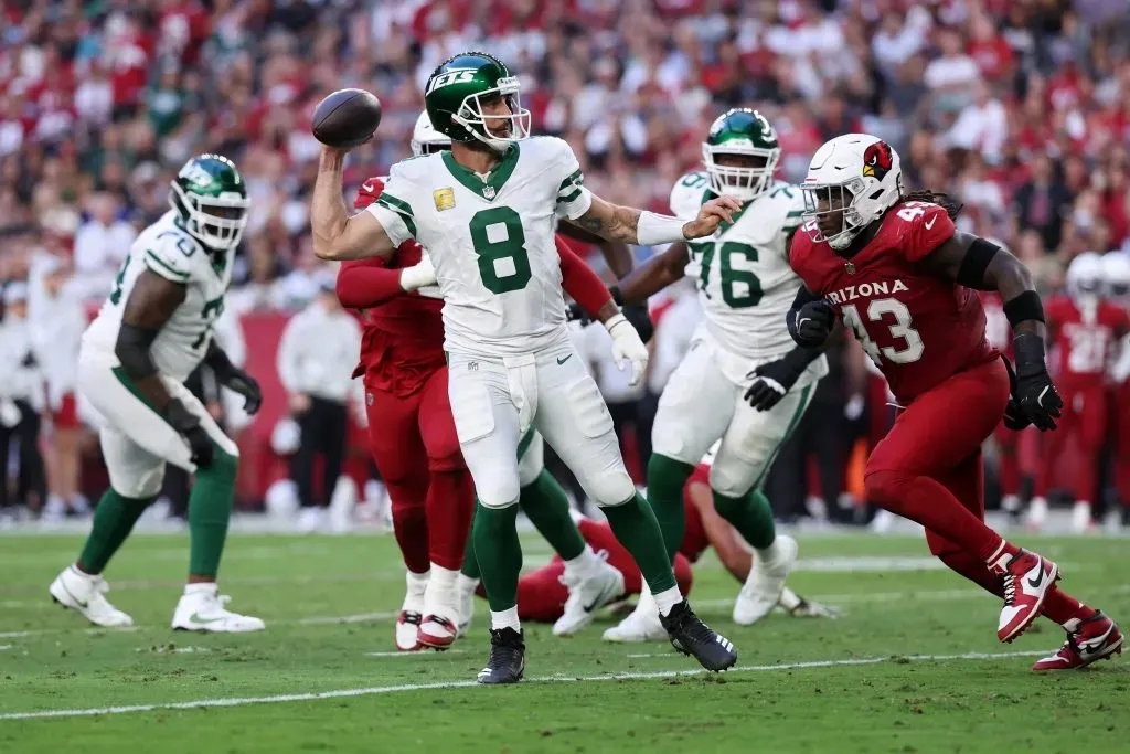 Aaron Rodgers #8 of the New York Jets throws a pass