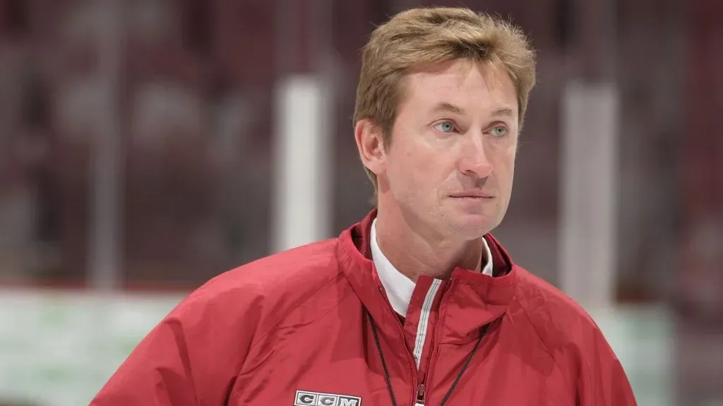 Wayne Gretzky of the Phoenix Coyotes warms up his team during a practice before the NHL game against the Vancouver Canucks at General Motors Place on October 5, 2005. (Source: Jeff Vinnick/Getty Images)