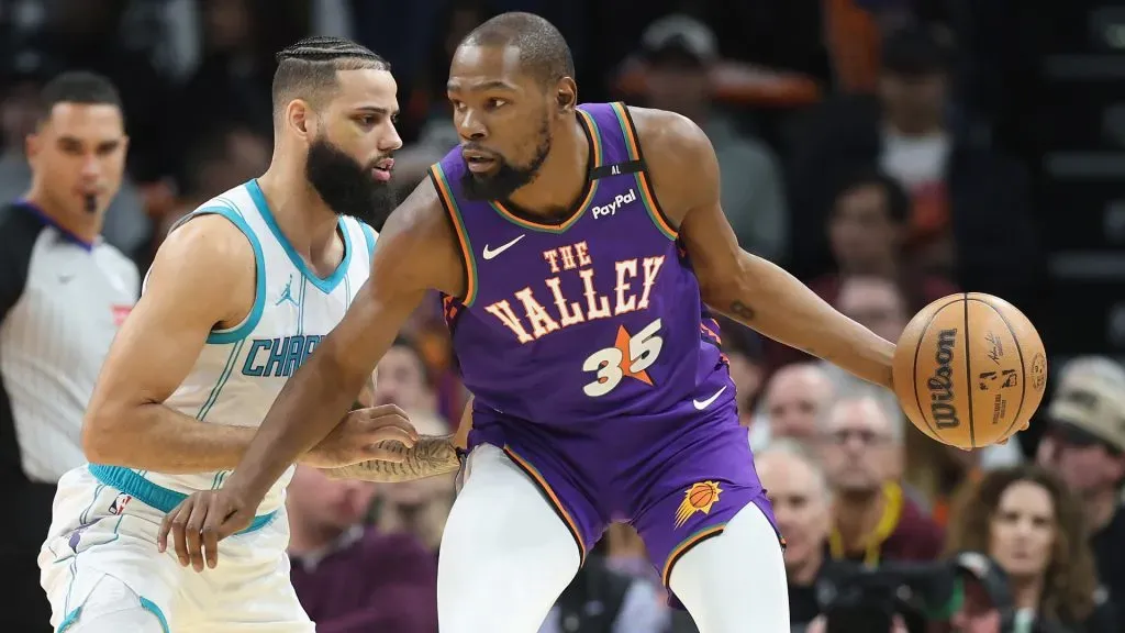 Kevin Durant #35 of the Phoenix Suns handles the ball under pressure from Cody Martin #11 of the Charlotte Hornets during the second half. (Christian Petersen/Getty Images)
