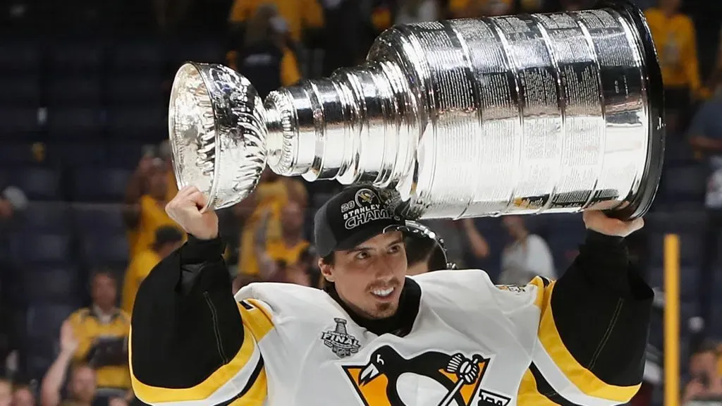 Marc-Andre Fleury #29 of the Pittsburgh Penguins celebrates with the Stanley Cup trophy after defeating the Nashville Predators 2-0 in Game Six of the 2017 NHL Stanley Cup Final at the Bridgestone Arena on June 11, 2017 in Nashville, Tennessee.