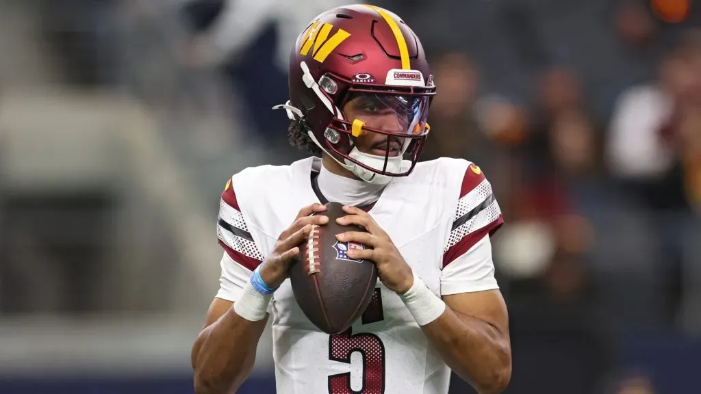 Jayden Daniels #5 of the Washington Commanders looks to pass the ball against the Dallas Cowboys during the first quarter at AT&T Stadium on January 05, 2025. (Source: Sam Hodde/Getty Images)