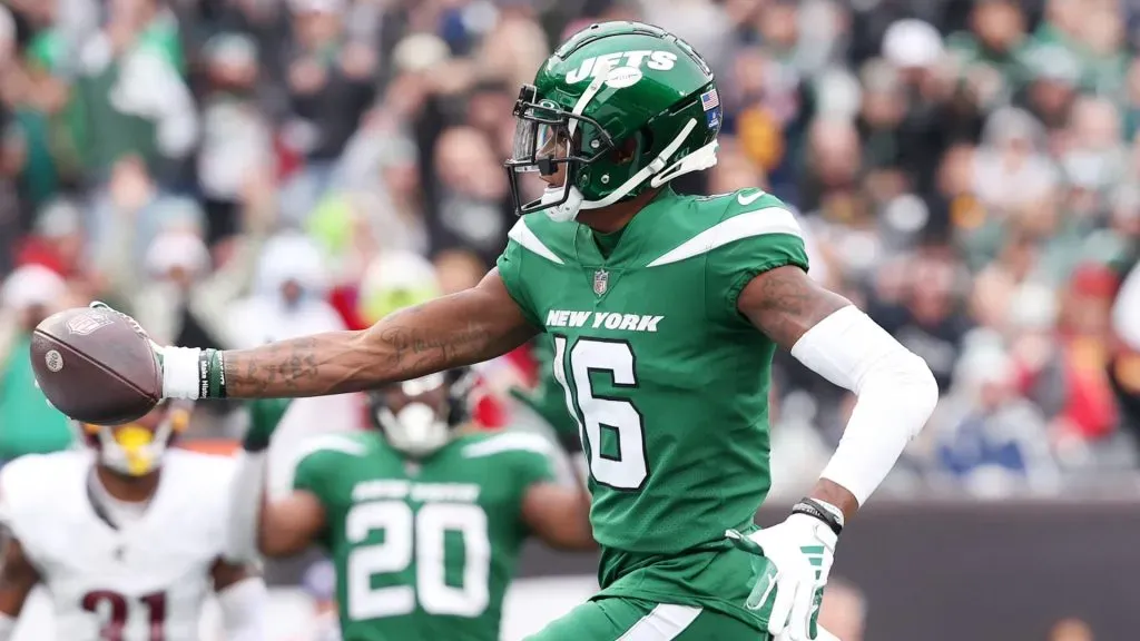 Jason Brownlee #16 of the New York Jets scores a touchdown during the first quarter against the Washington Commanders at MetLife Stadium on December 24, 2023 in East Rutherford, New Jersey.