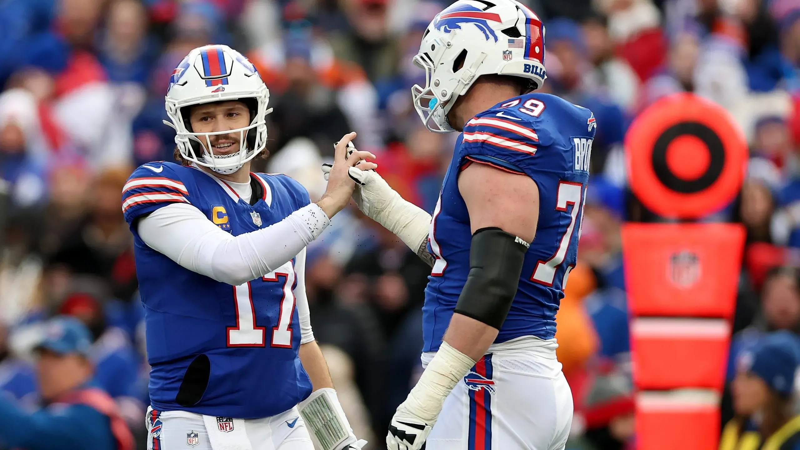 Josh Allen #17 and Spencer Brown #79 of the Buffalo Bills
