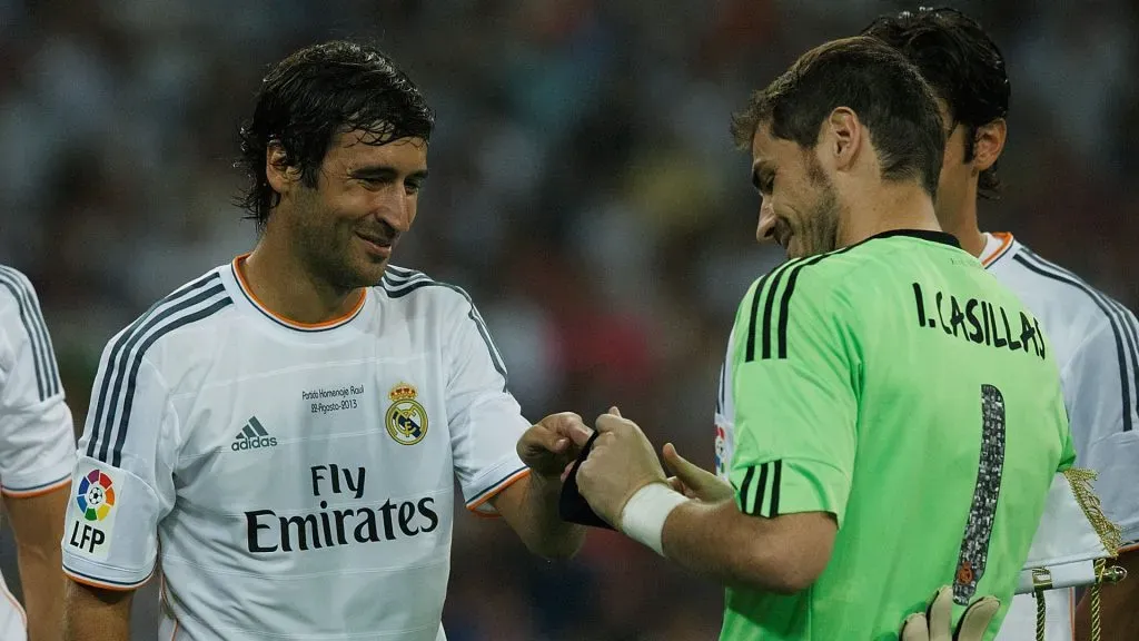 Goalkeeper Iker Casillas of Real Madrid CF gives the captain armband to Raul prior to start the Santiago Bernabeu Trophy match between Real Madrid CF and Al-Sadd. (Gonzalo Arroyo Moreno/Getty Images)