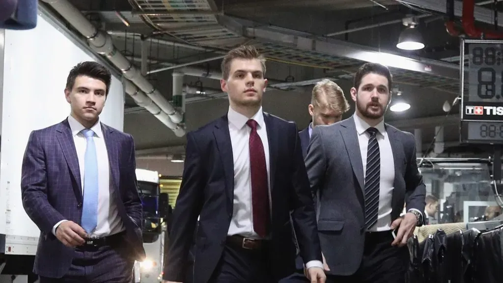 Nick Suzuki #14, Jake Evans #71 and Xavier Ouellet #61 of the Montreal Canadiens arrive for their game against the New York Islanders at the Barclays Center on March 03, 2020 in the Brooklyn borough of New York City.