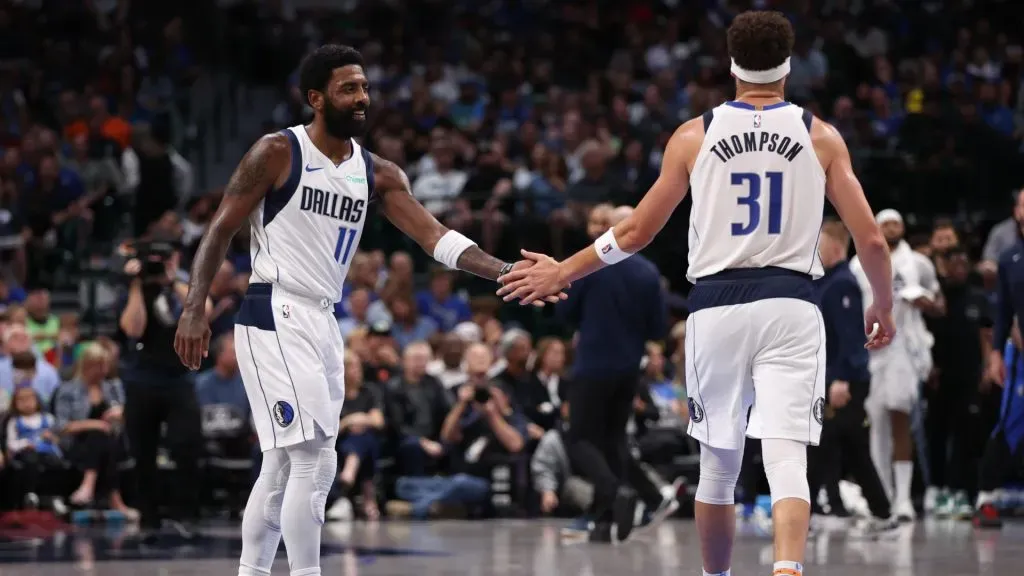 Kyrie Irving #11 and Klay Thompson #31 of the Dallas Mavericks celebrate after a score during the second half against the Orlando Magic at American Airlines Center on November 03, 2024 in Dallas, Texas.