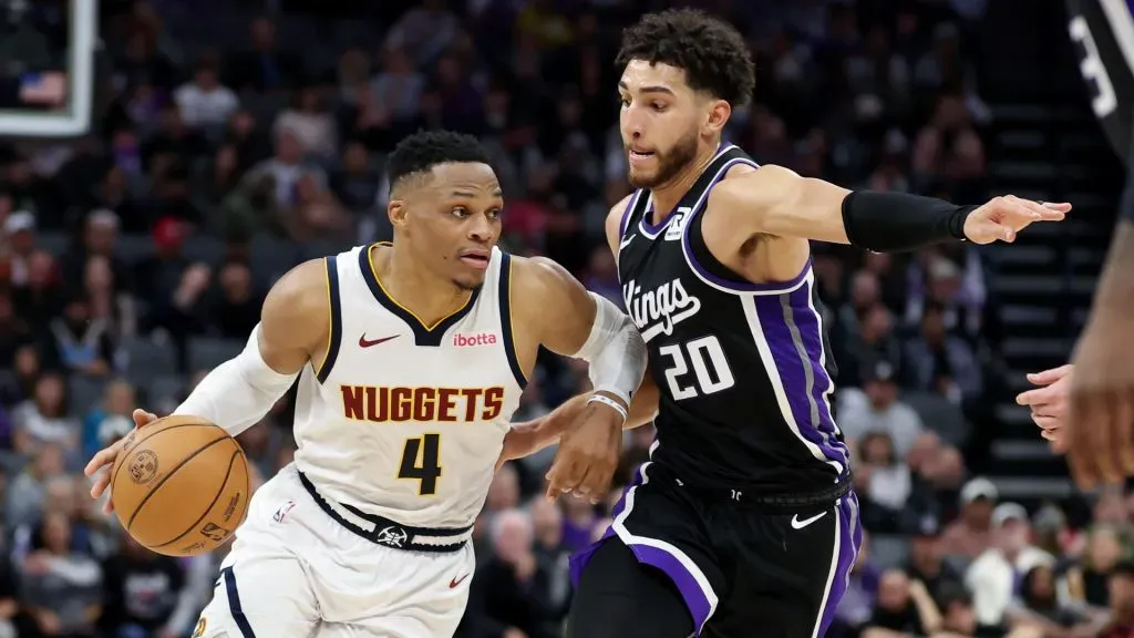 Russell Westbrook #4 of the Denver Nuggets is guarded by Colby Jones #20 of the Sacramento Kings in the second half at Golden 1 Center. (Ezra Shaw/Getty Images)