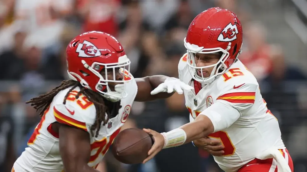 Patrick Mahomes #15 of the Kansas City Chiefs hands the football off to Kareem Hunt #29 during the NFL game against the Las Vegas Raiders at Allegiant Stadium on October 27, 2024 in Las Vegas, Nevada. The Chiefs defeated the Raiders 27-20.