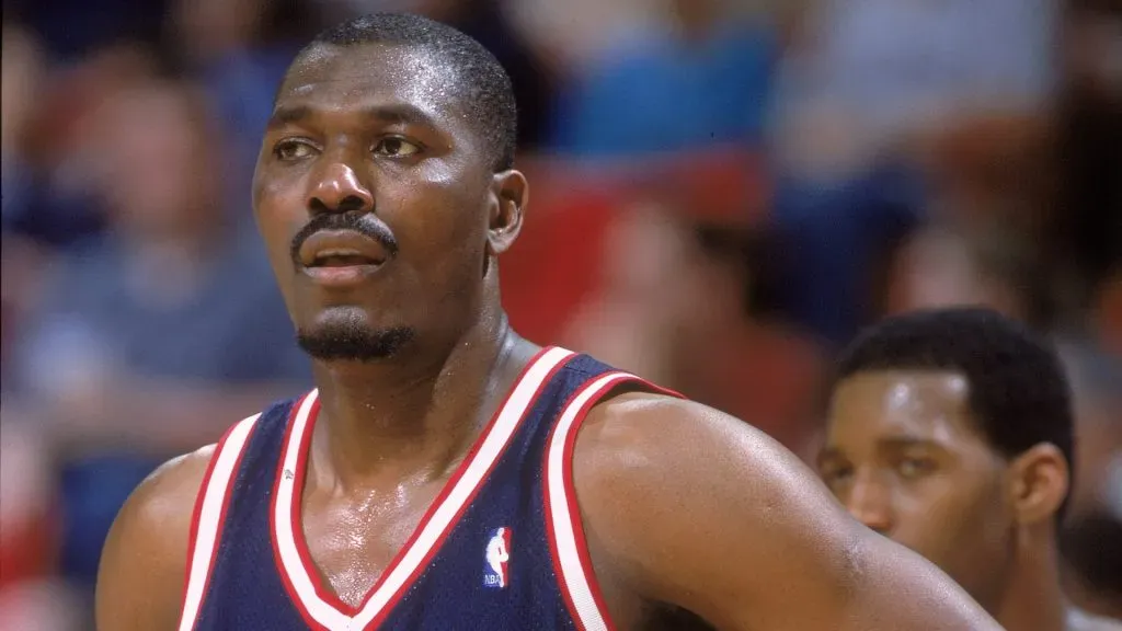 Hakeem Olajuwon #34 of the Houston Rockets stands on the court during the game against the Orlando Magic at the Compaq Center in 2001. (Source: Andy Lyons /Allsport)
