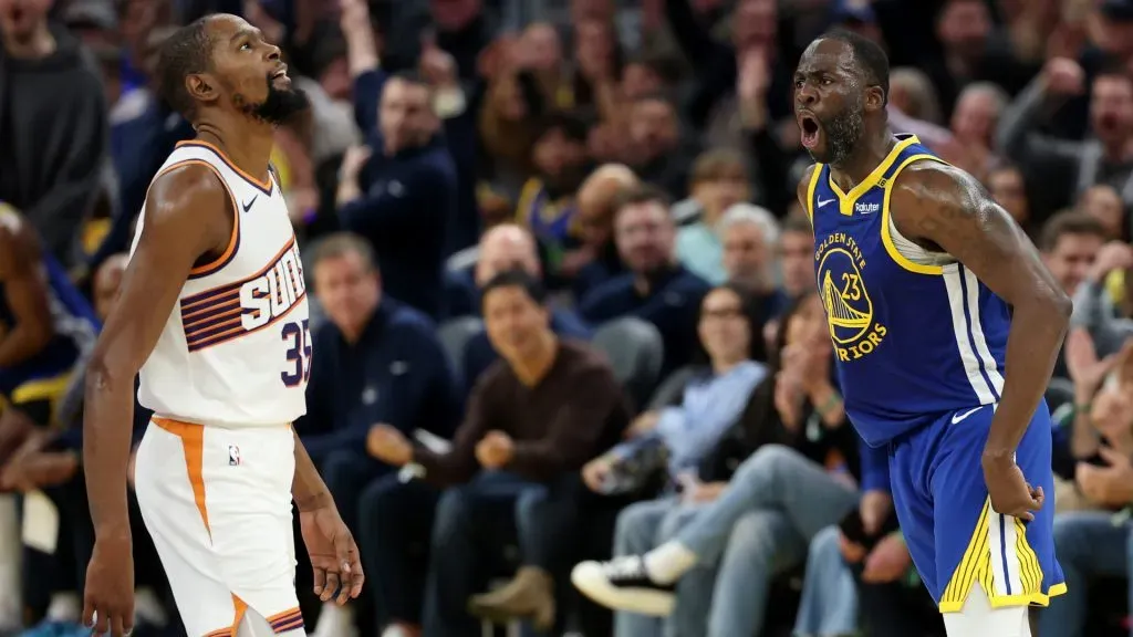 Draymond Green #23 of the Golden State Warriors reacts after he made a three-point basket over Kevin Durant #35 of the Phoenix Suns in the first half at Chase Center. (Ezra Shaw/Getty Images)