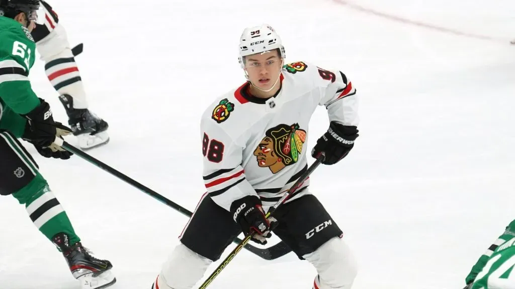 Connor Bedard 98 of Chicago Blackhawks controls the puck during the NHL match against Dallas Stars at American Airlines Center.