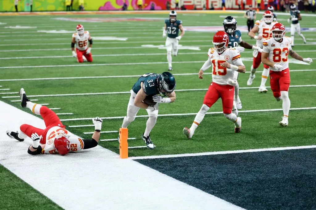 Cooper DeJean #33 of the Philadelphia Eagles scores a touchdown past Patrick Mahomes #15 of the Kansas City Chiefs