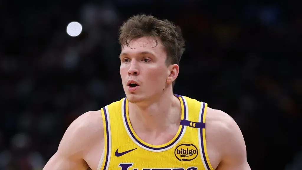 Dalton Knecht #4 of the Los Angeles Lakers controls the ball against the Washington Wizards