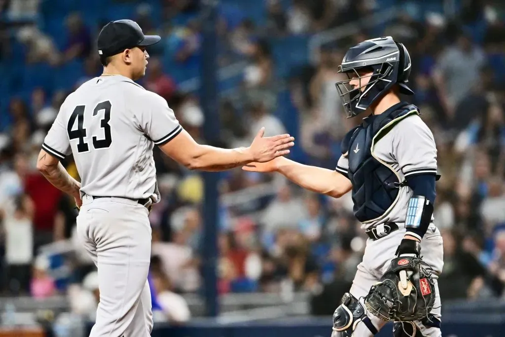 Jonathan Loaisiga (L) #43 celebrates with Ben Rortvedt #38 of the New York Yankees