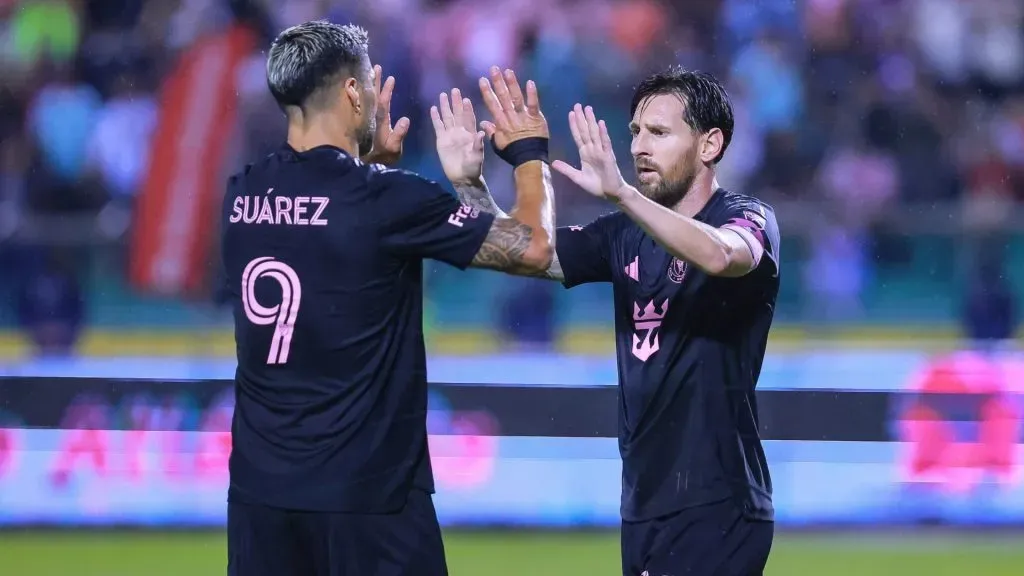 Lionel Messi of Inter Miami celebrates with teammate Luis Suarez after scoring the teamās first goal during a friendly match between Olimpia and Inter Miami. (Manuel Velasquez/Getty Images)