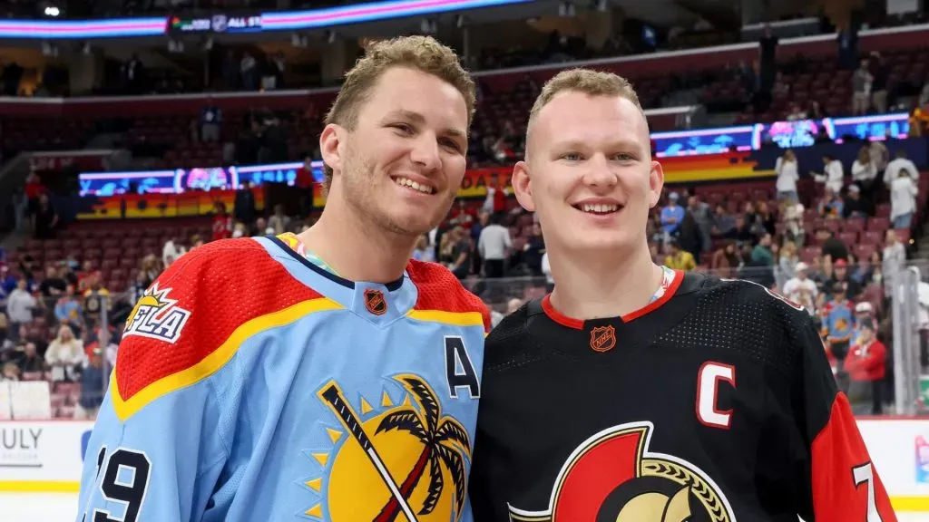 Matthew Tkachuk #19 of the Florida Panthers and Brady Tkachuk #7 of the Ottawa Senators pose during the 2023 NHL All-Star Skills Competition at FLA Live Arena on February 03, 2023 in Sunrise, Florida.