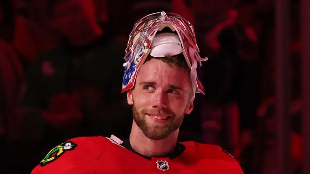 Spencer Knight #30 of the Chicago Blackhawks waves as he is acknowledged after the game against the Los Angeles Kings at the United Center on March 03, 2025 in Chicago, Illinois.