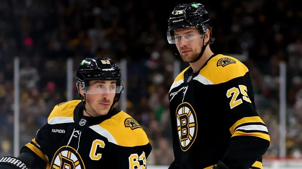 Brad Marchand #63 and Brandon Carlo #25 of the Boston Bruins during a game at TD Garden.