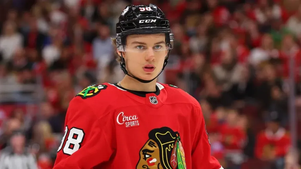 Connor Bedard #98 of the Chicago Blackhawks looks on against the Minnesota Wild during the second period of a preseason game at the United Center on October 04, 2024 in Chicago, Illinois.