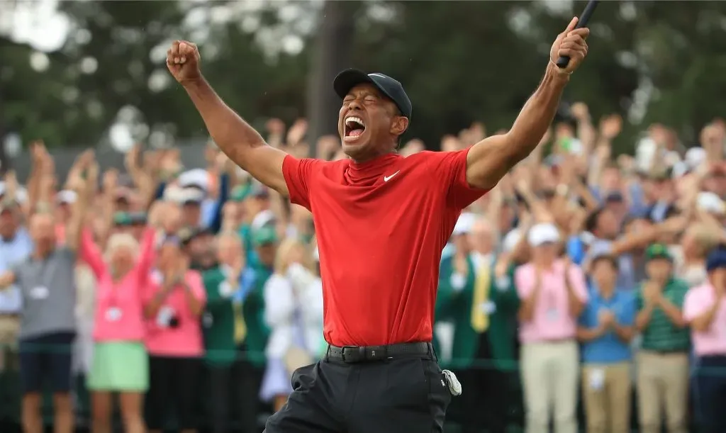 Tiger Woods of the United States celebrates on the 18th green after winning the Masters at Augusta National Golf Club on April 14, 2019. (Source: Andrew Redington/Getty Images)