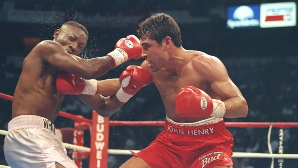 12 Apr 1997: Oscar De La Hoya lands a right to Pernell Whitaker during a fight at the Thomas and Mack Center in Las Vegas, Nevada. De La Hoya won the fight by decision. Mandatory Credit: Al Bello /Allsport