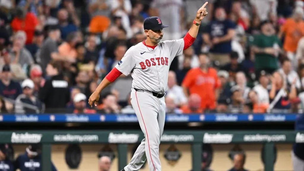Alex Cora #13 of the Boston Red Sox walks out to the mound for a pitching change in the seventh inning against the Houston Astros at Minute Maid Park on August 21, 2024 in Houston, Texas. (Photo by Maria Lysaker/Getty Images)