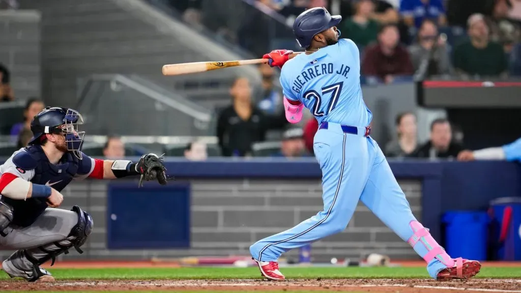 Vladimir Guerrero Jr. #27 of the Toronto Blue Jays hits a two-RBI double against the Boston Red Sox during the third inning in their MLB game at the Rogers Centre on September 24, 2024 in Toronto, Ontario, Canada. (Photo by Mark Blinch/Getty Images)