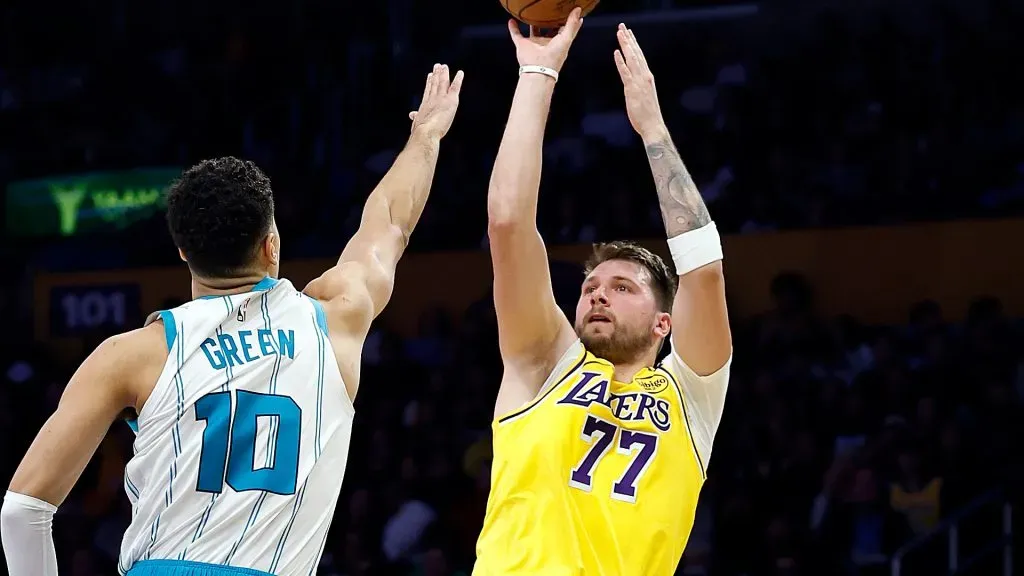 Luka Doncic #77 of the Los Angeles Lakers takes a shot against Josh Green #10 of the Charlotte Hornets