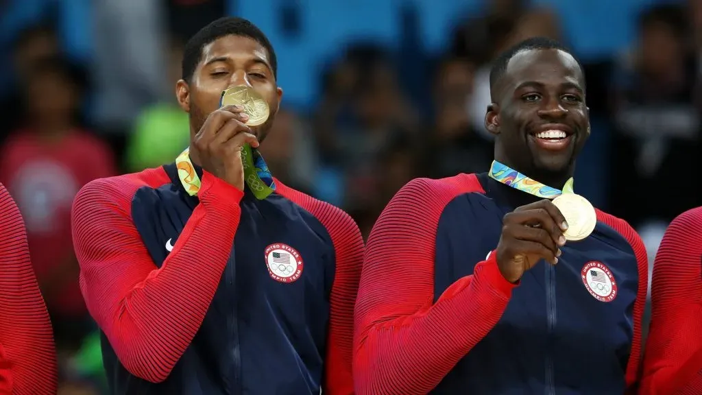 Paul George and Draymond Green stand on the podium with gold medals after defeating Serbia during the Men’s Gold medal game on Day 16 of the Rio 2016 Olympic Games