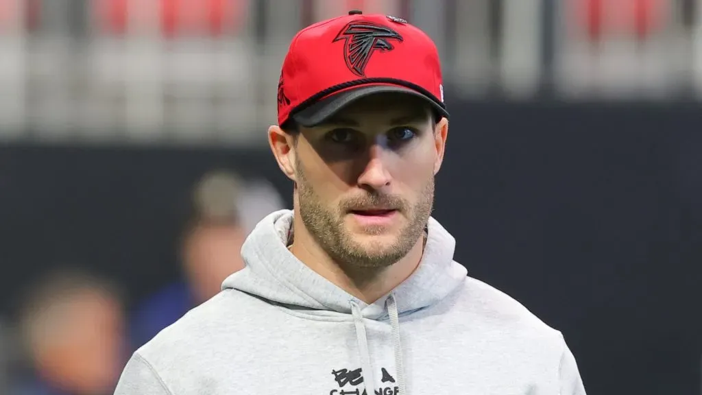 Kirk Cousins looks on before a game