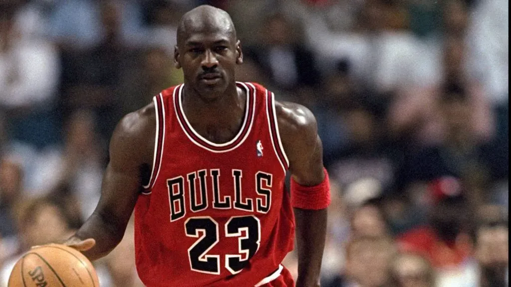 Michael Jordan of the Chicago Bulls looks on during an NBA game.