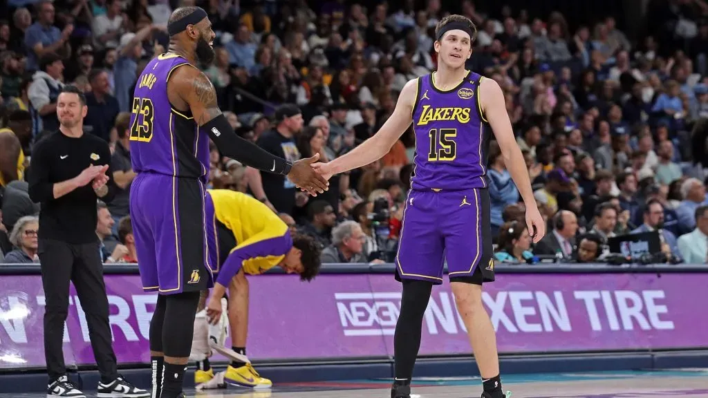 LeBron James #23 and Austin Reaves #15 interact during the first half against the Memphis Grizzlies. (Justin Ford/Getty Images)