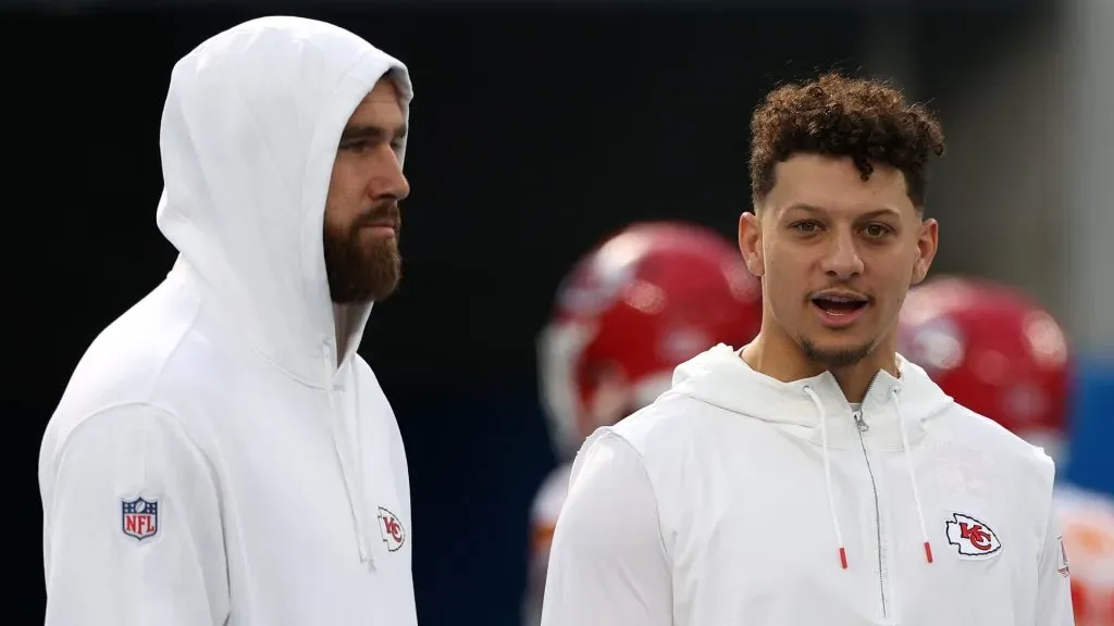Travis Kelce #87 and Patrick Mahomes #15 of the Kansas City Chiefs speak before a game against the Los Angeles Chargers at SoFi Stadium on January 07, 2024 in Inglewood, California.