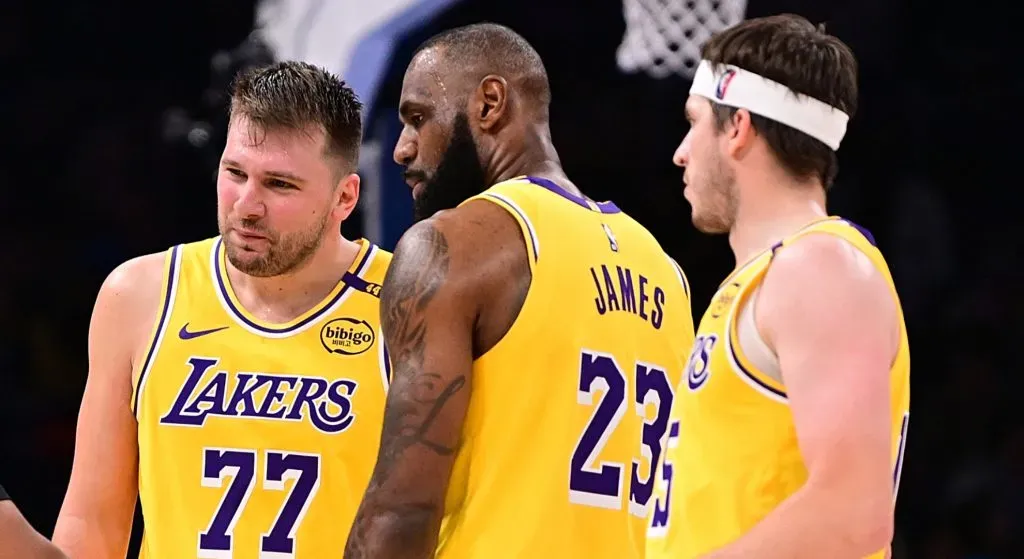 Luka Doncic #77 and Lebron James #23 of the Los Angeles Lakers speak to an official during the second half against the Oklahoma City Thunder at Paycom Center on April 8, 2025 in Oklahoma City, Oklahoma.