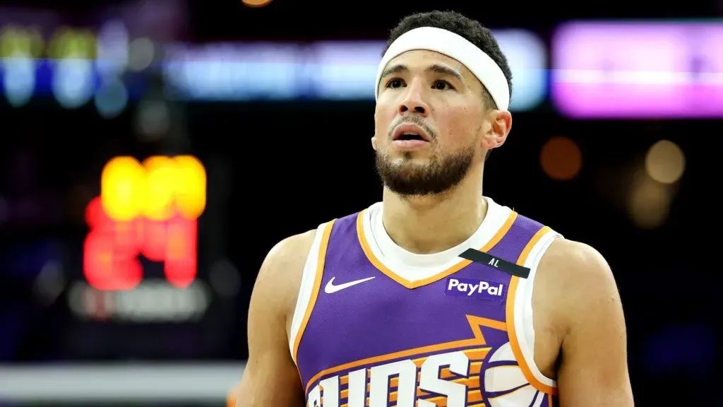 Devin Booker #1 of the Phoenix Suns looks on during a game against the Philadelphia 76ers at the Wells Fargo Center.