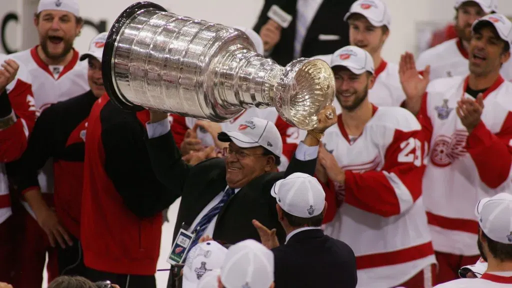 Consultant Scotty Bowman of the Detroit Red Wings celebrates with the Stanley Cup after defeating the Pittsburgh Penguins in game six of the 2008 NHL Stanley Cup Finals. (Source: Jim McIsaac/Getty Images)